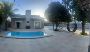 Casa com quadra de areia